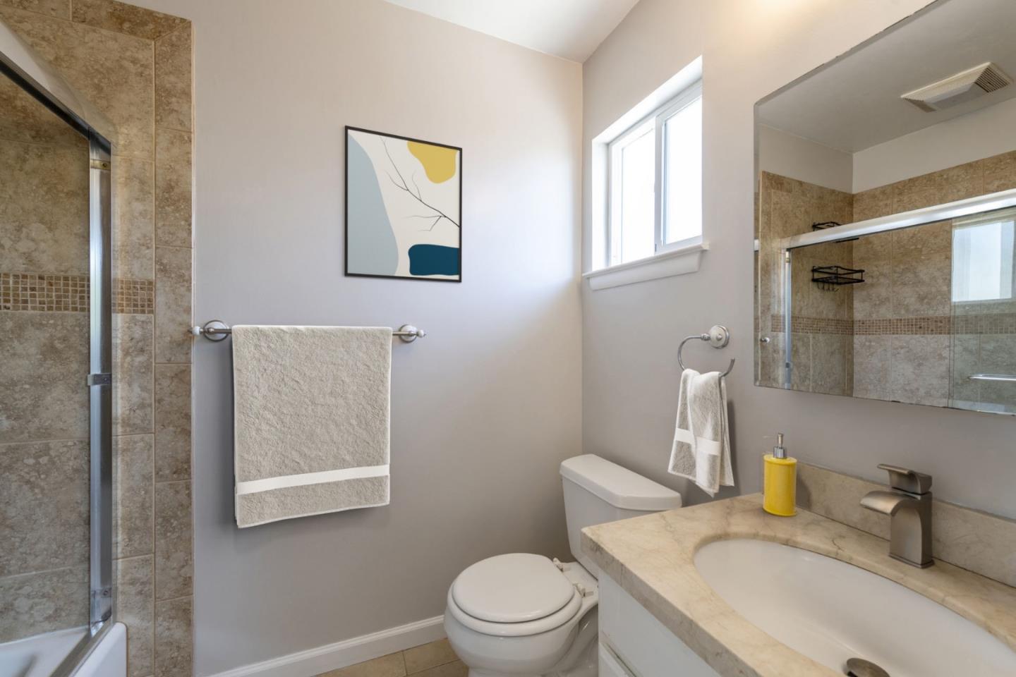 168 Salada Avenue Pacifica, CA 94044 - Photo 3 of 12 a white toilet sitting next to a bathroom sink