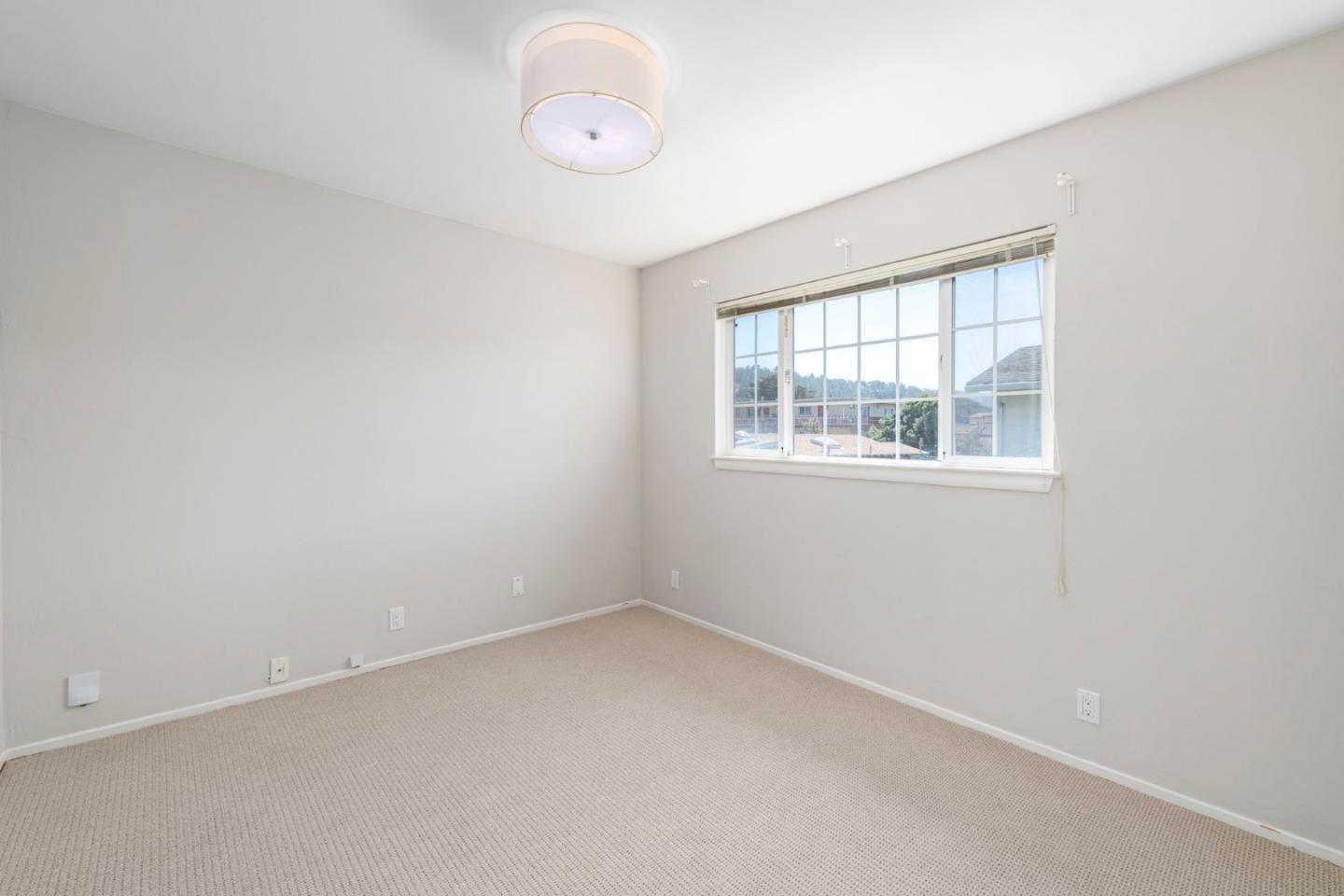 168 Salada Avenue Pacifica, CA 94044 - Photo 8 of 12 an empty room with a window