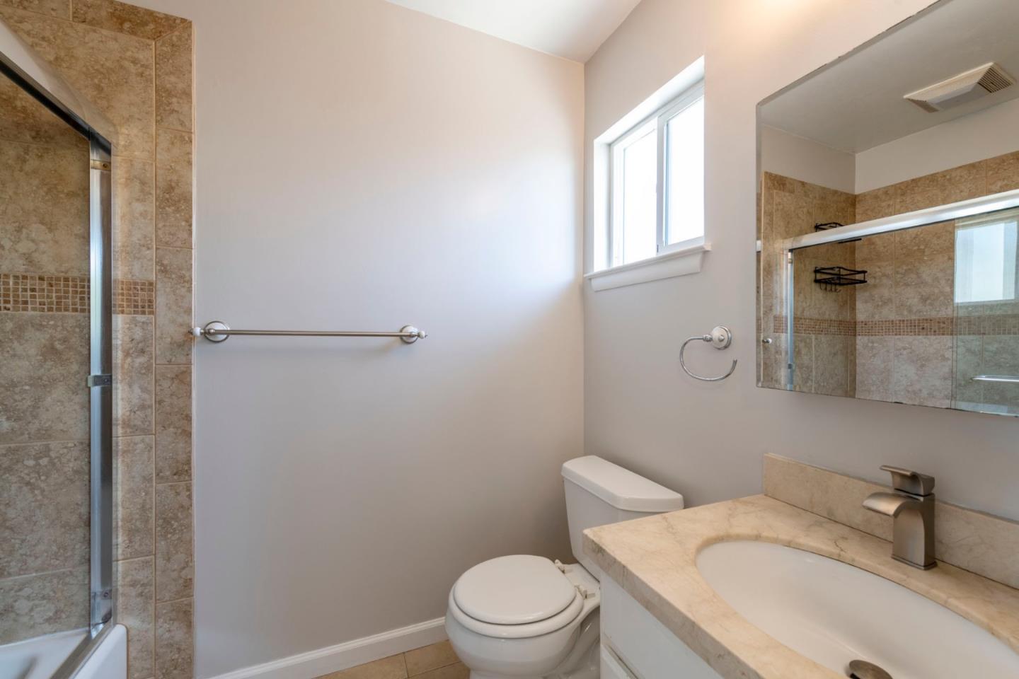 168 Salada Avenue Pacifica, CA 94044 - Photo 9 of 12 a white toilet sitting next to a bathroom sink