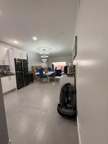 a bedroom with a bed and a chair