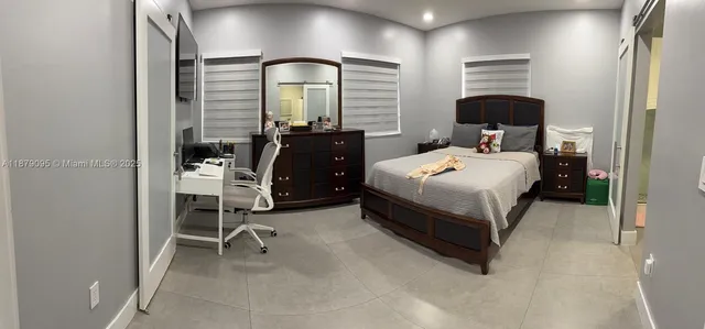 a bedroom with a bed and a closet