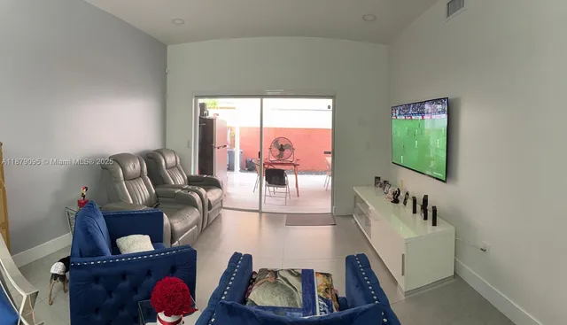 a bathroom with a sink mirror and vanity