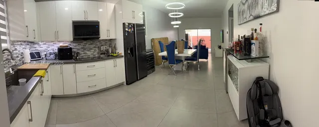 a view of living room with furniture and flat screen tv