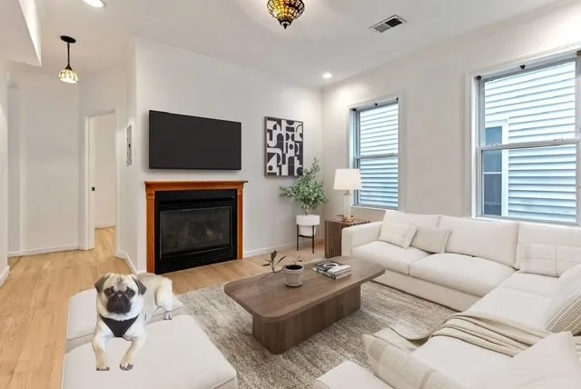 a living room with furniture and a fireplace
