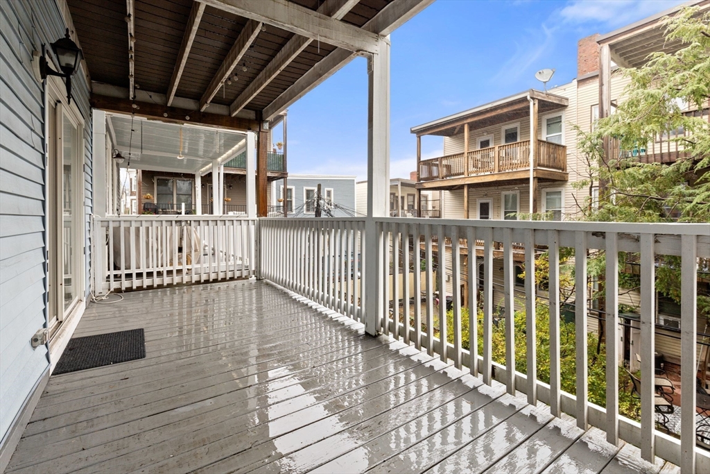 8 Peters Street, Unit B Boston, MA 02127 - Photo 11 of 14 a view of a balcony with wooden floor
