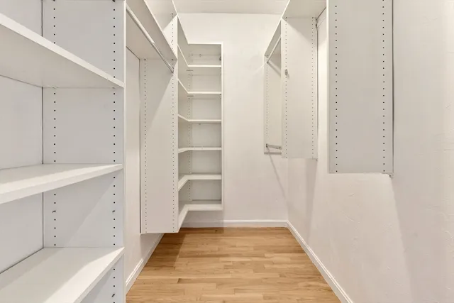 a view of an empty walk in closet