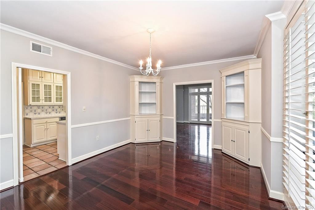 908 Cherokee Road, Unit 908 Charlotte, NC 28207 - Photo 11 of 35 wooden floor in an empty room with a window