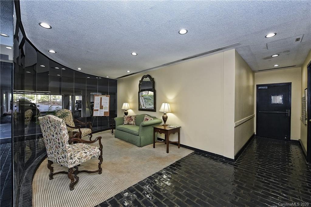 908 Cherokee Road, Unit 908 Charlotte, NC 28207 - Photo 3 of 35 a living room with furniture and a wooden floor