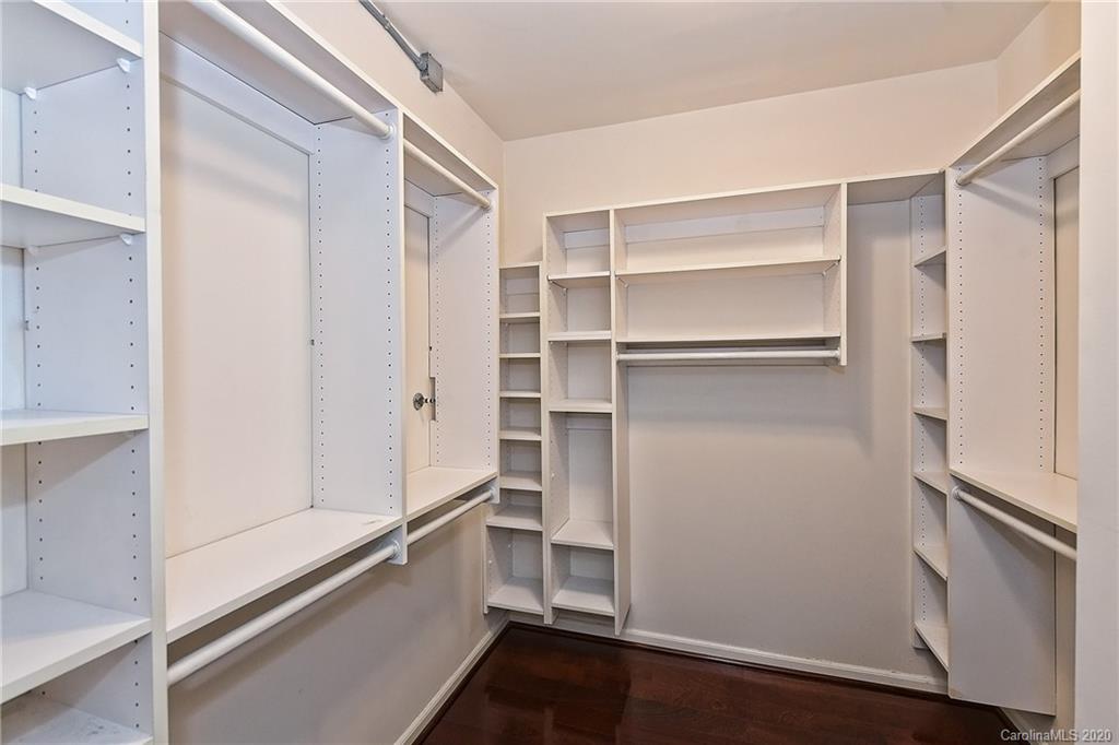 908 Cherokee Road, Unit 908 Charlotte, NC 28207 - Photo 25 of 35 a view of walk in closet with empty racks