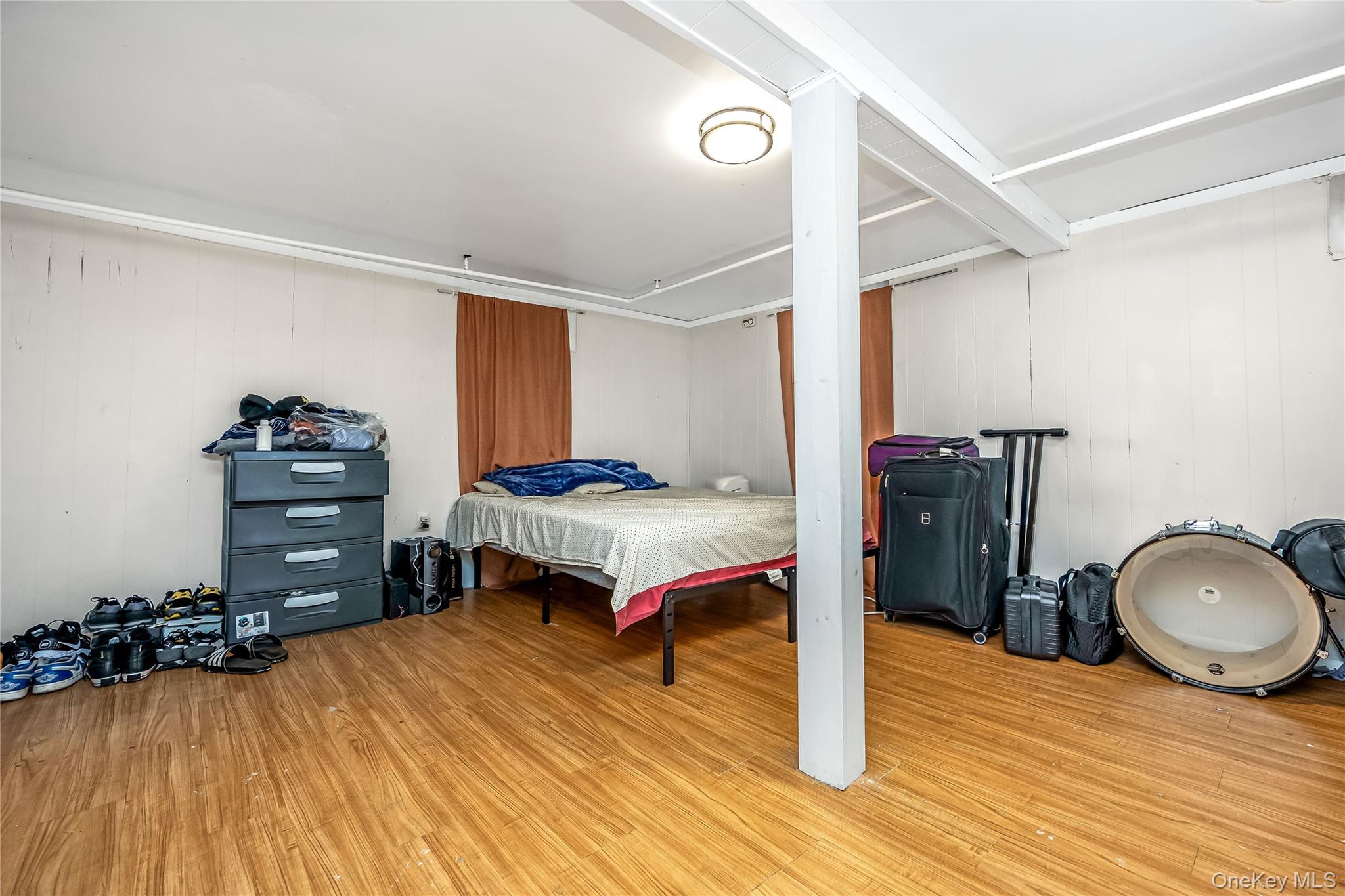 97 Berry Street Lindenhurst, NY 11757 - Photo 16 of 23 a bedroom with a bed and a dresser