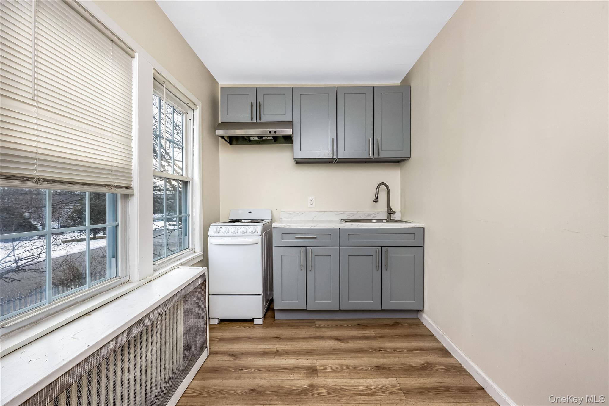 97 Berry Street Lindenhurst, NY 11757 - Photo 18 of 23 a bathroom with a sink and a window