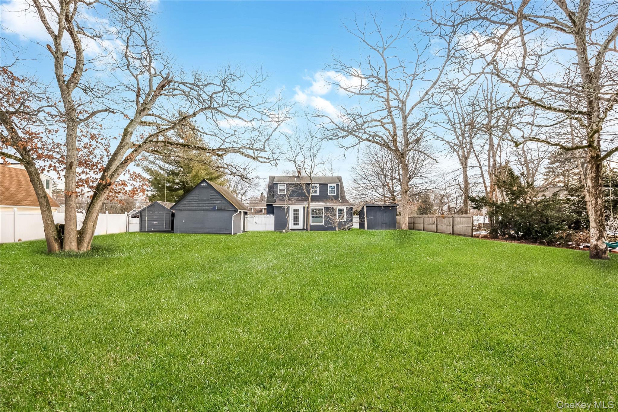 97 Berry Street Lindenhurst, NY 11757 - Photo 3 of 23 a view of a building with a yard