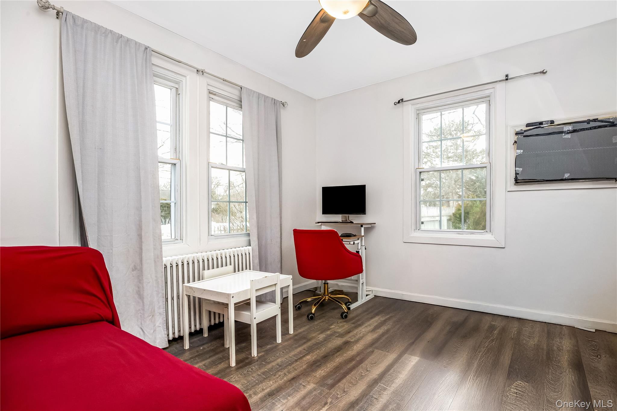 97 Berry Street Lindenhurst, NY 11757 - Photo 9 of 23 a bedroom with furniture and a window