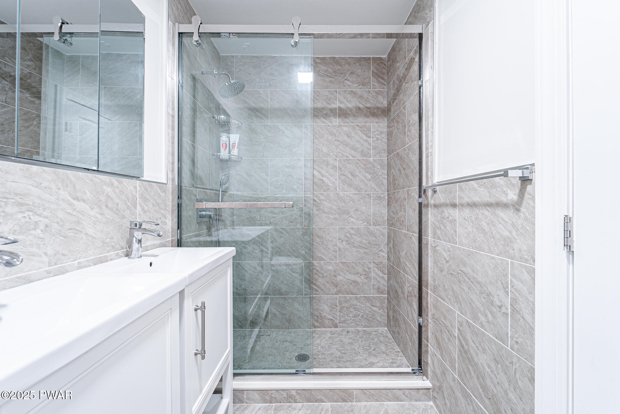 153 Hatton Road Hawley, PA 18428 - Photo 19 of 38 a bathroom with a shower and a sink