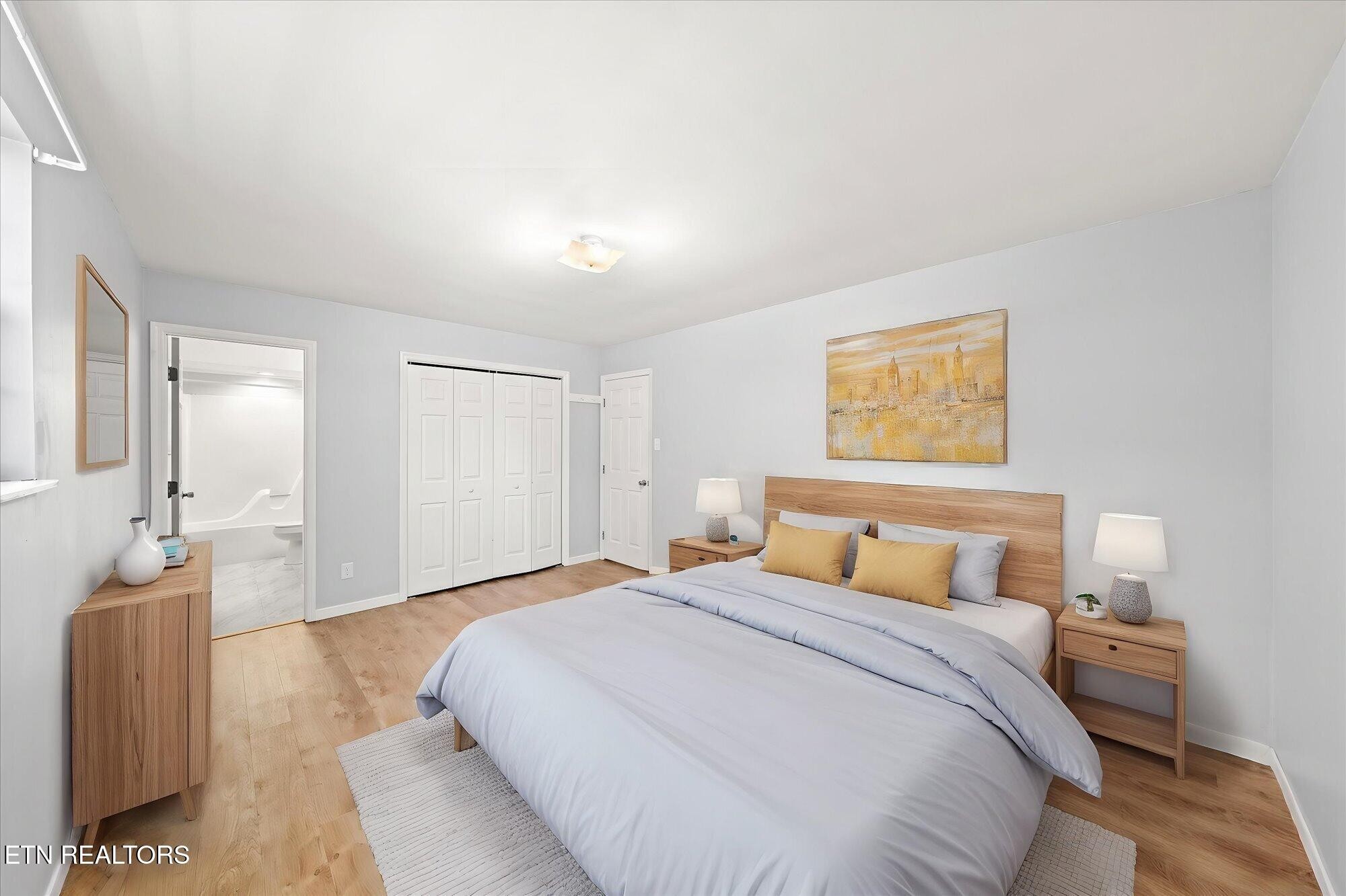 437 Oran Road Knoxville, TN 37934 - Photo 11 of 20 a bedroom with a large bed and a chandelier