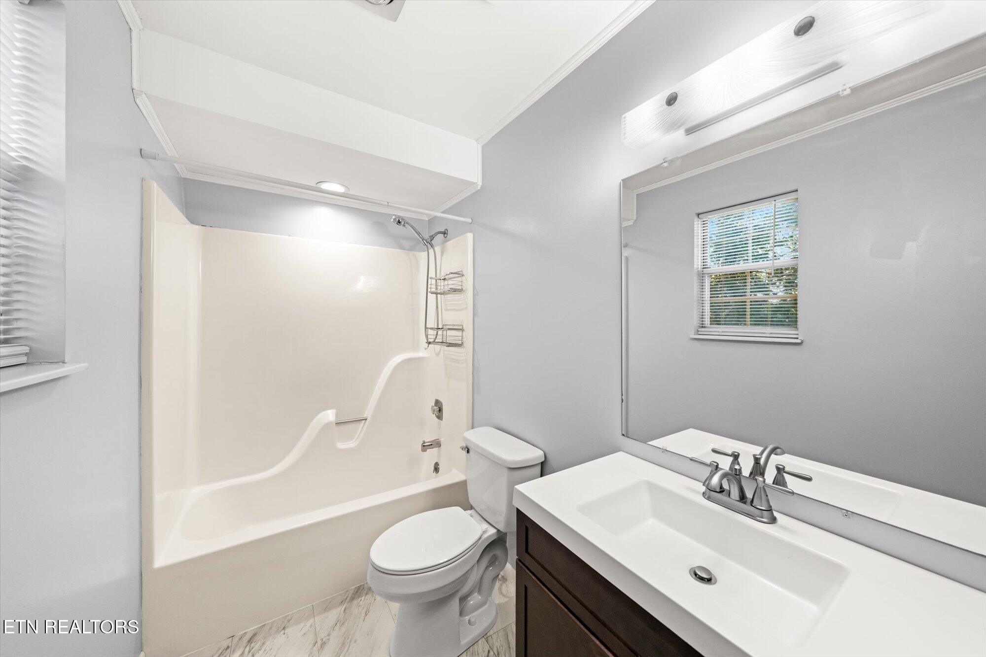 437 Oran Road Knoxville, TN 37934 - Photo 12 of 20 a bathroom with a sink toilet and shower