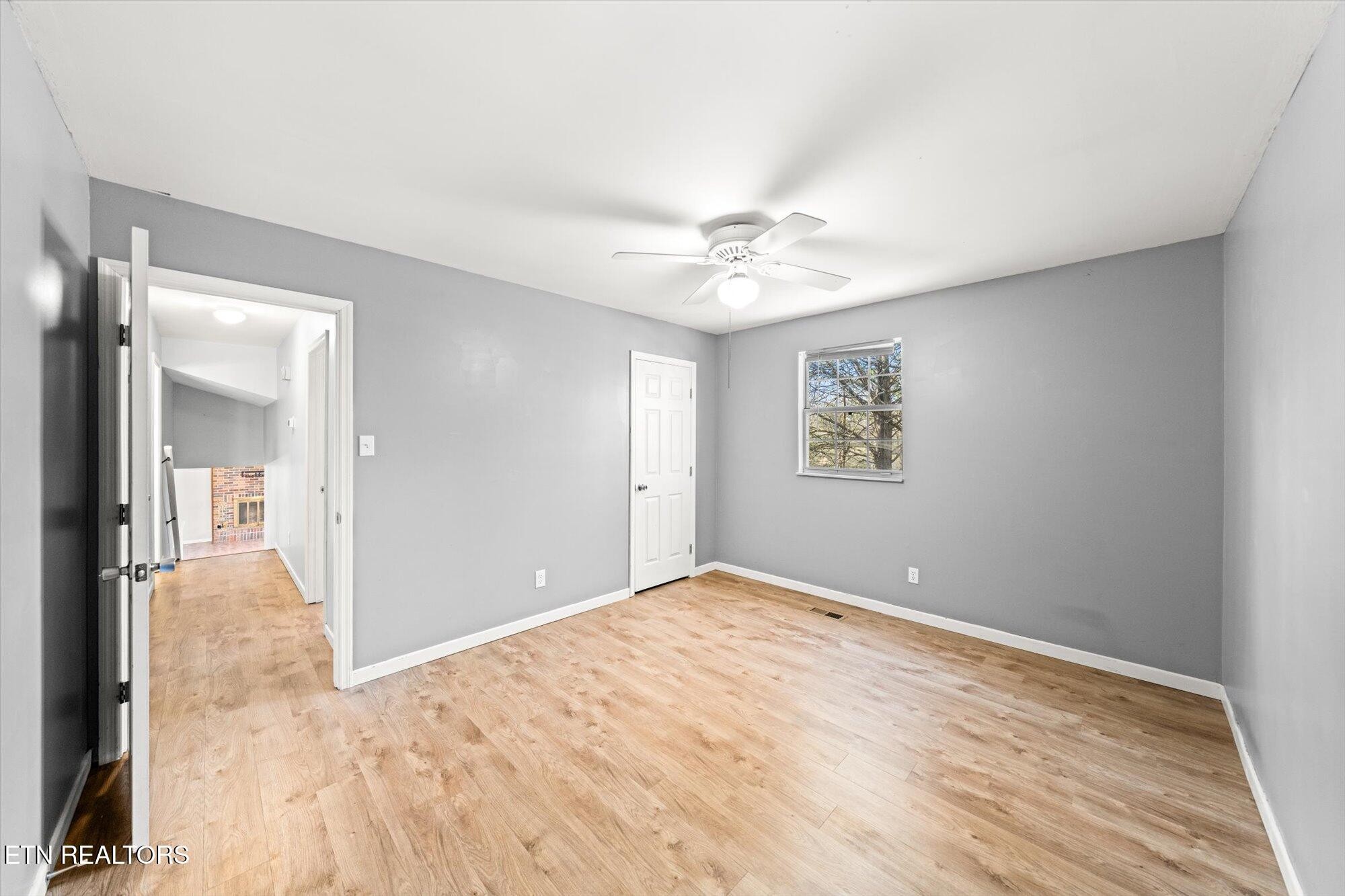 437 Oran Road Knoxville, TN 37934 - Photo 13 of 20 a view of an empty room with a chandelier fan