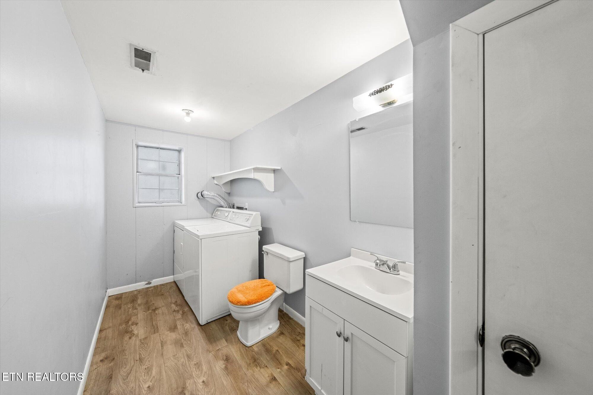 437 Oran Road Knoxville, TN 37934 - Photo 16 of 20 a bathroom with a toilet sink and mirror
