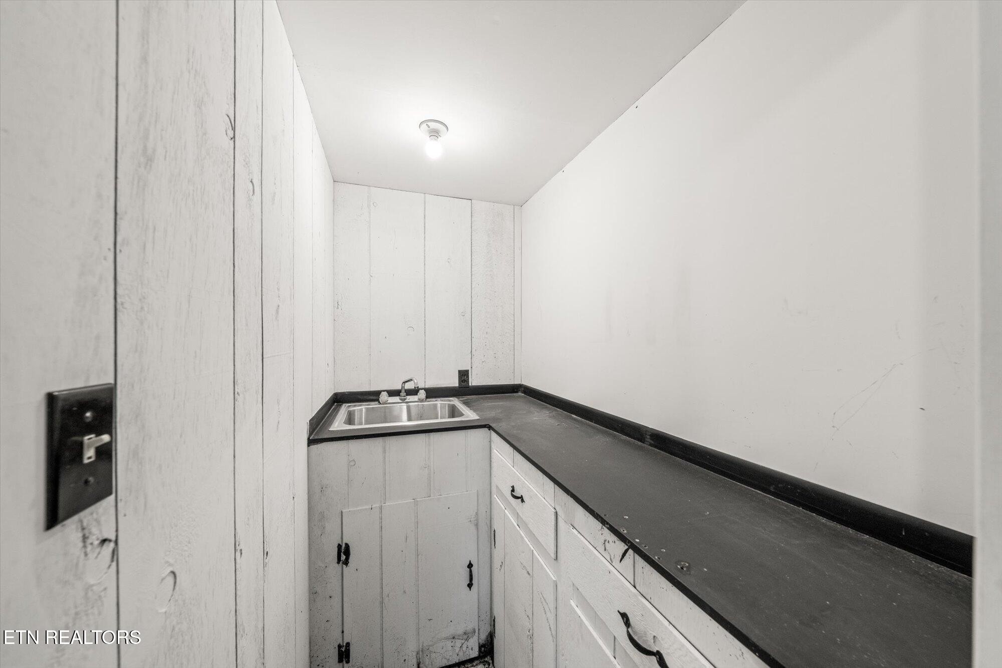 437 Oran Road Knoxville, TN 37934 - Photo 18 of 20 a kitchen with a sink and cabinets