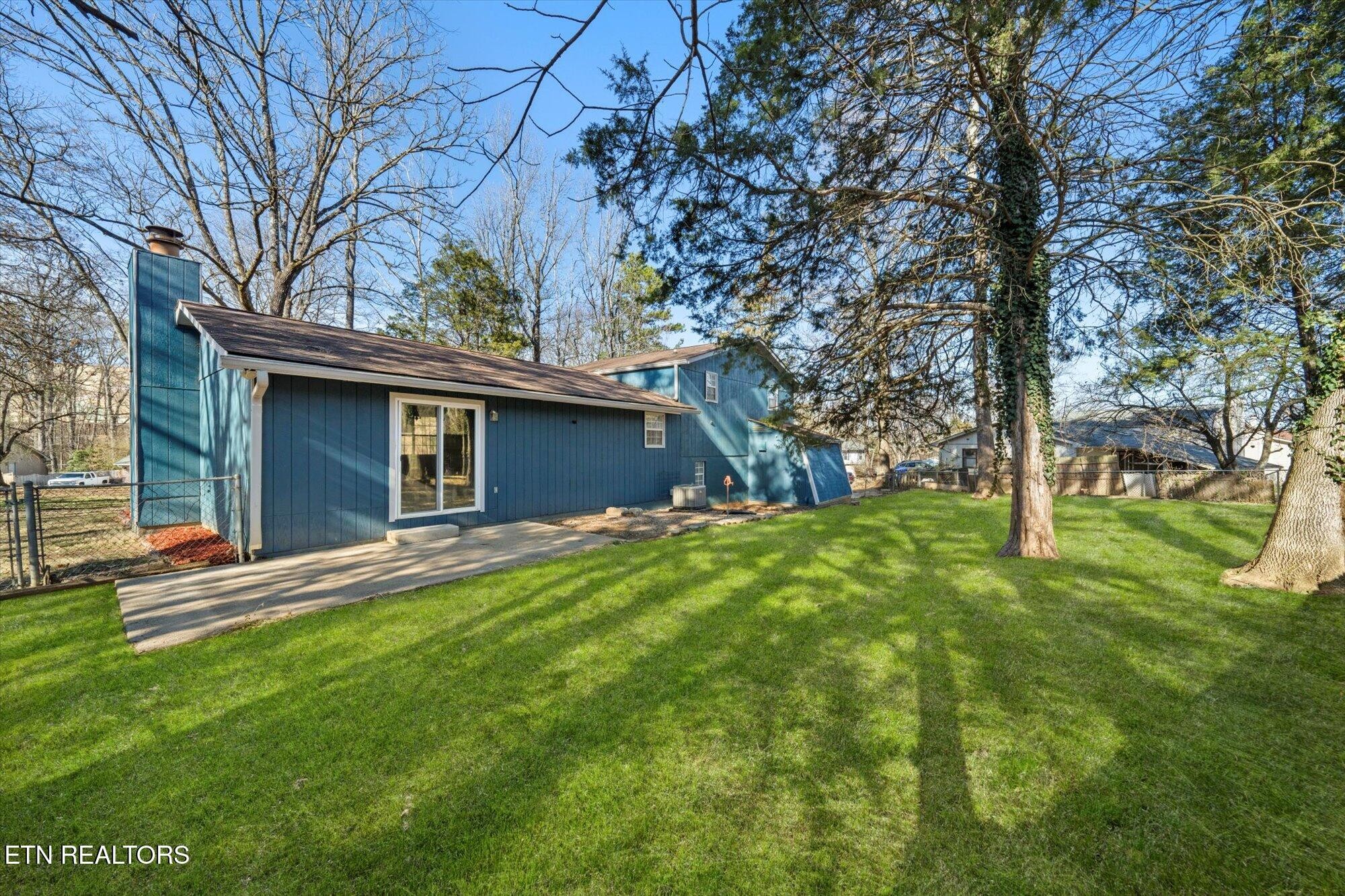437 Oran Road Knoxville, TN 37934 - Photo 20 of 20 a view of a backyard with table and chairs and large trees