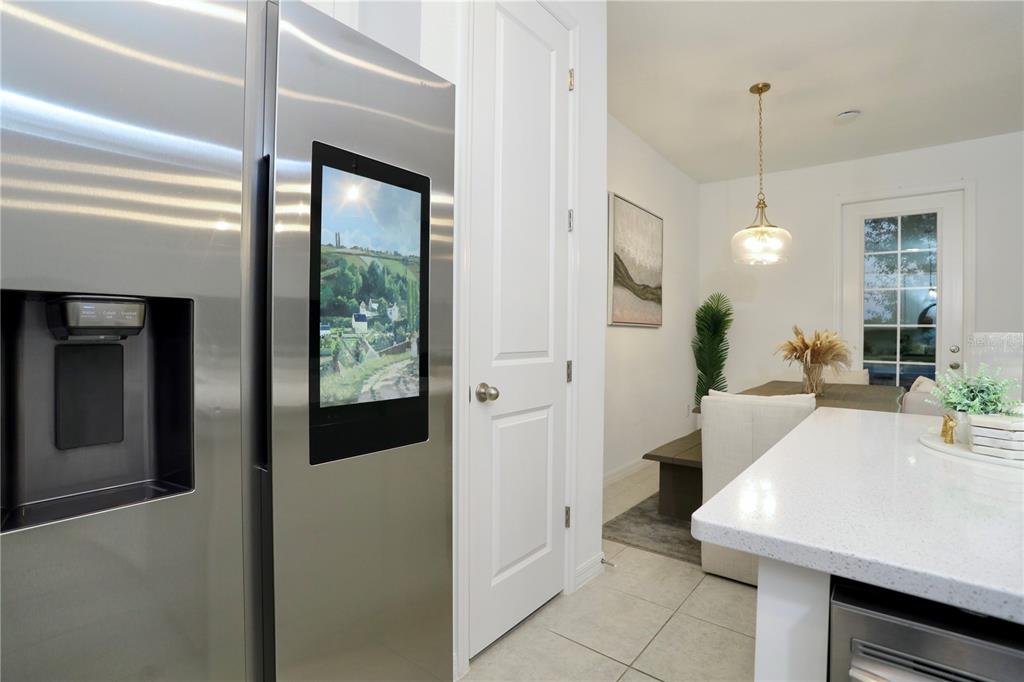 943 Conch Road Davenport, FL 33896 - Photo 18 of 43 a view of a kitchen from a hallway