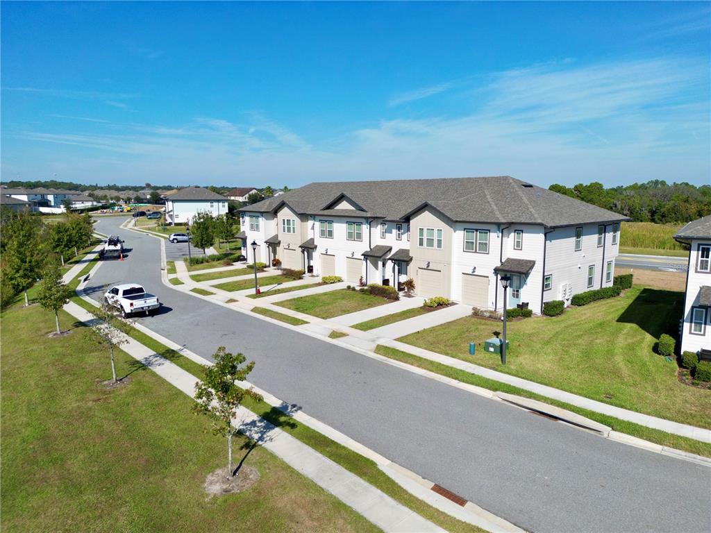 943 Conch Road Davenport, FL 33896 - Photo 40 of 42 a view of a patio with swimming pool table and chairs