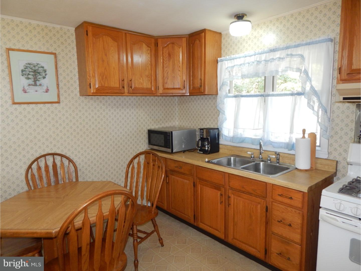 25 Downing Road Hamilton, NJ 08690 - Photo 2 of 14 a dining room with a window