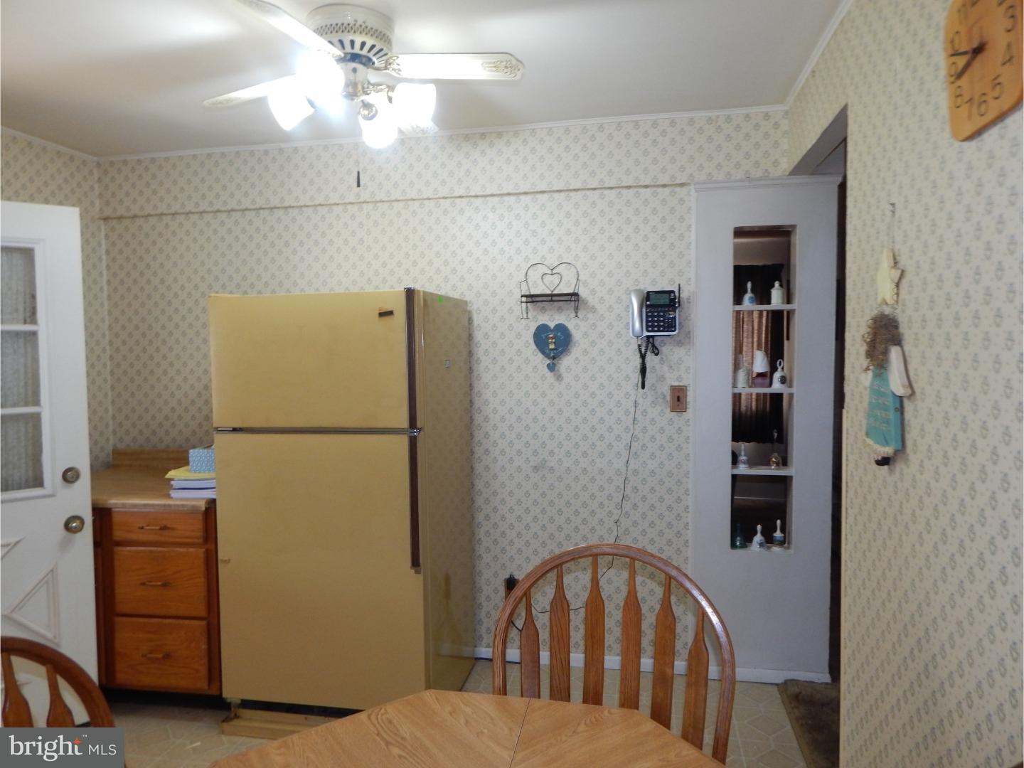25 Downing Road Hamilton, NJ 08690 - Photo 4 of 14 a bedroom with a white bed and a chandelier