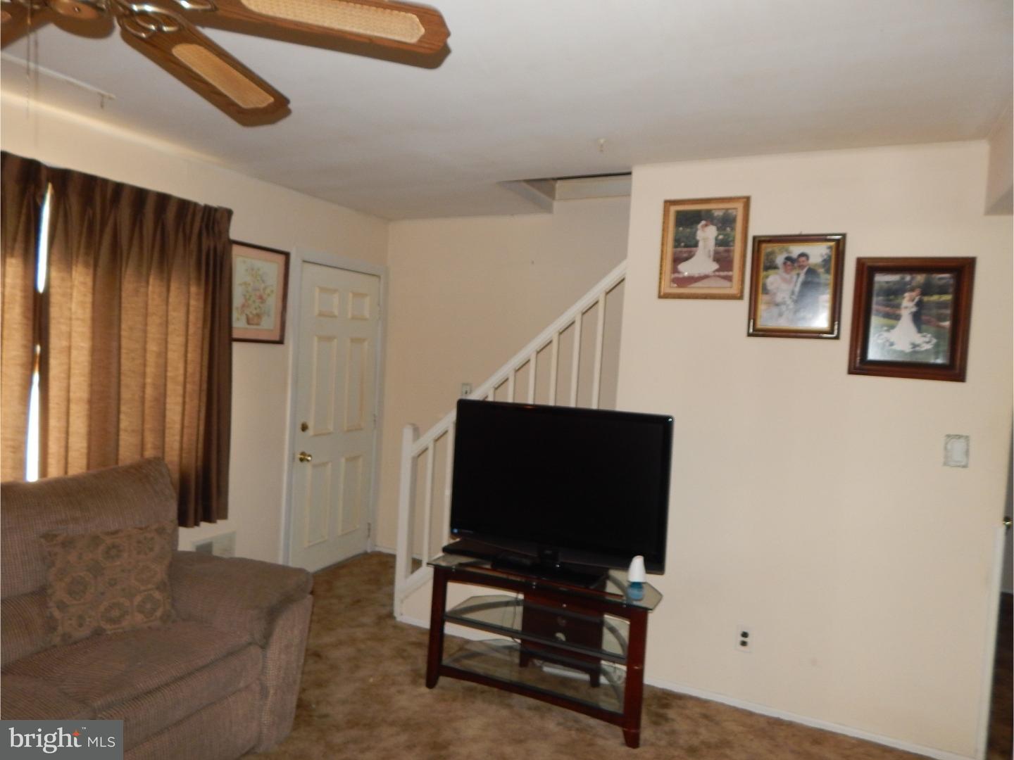 25 Downing Road Hamilton, NJ 08690 - Photo 5 of 14 a living room with furniture and a flat screen tv