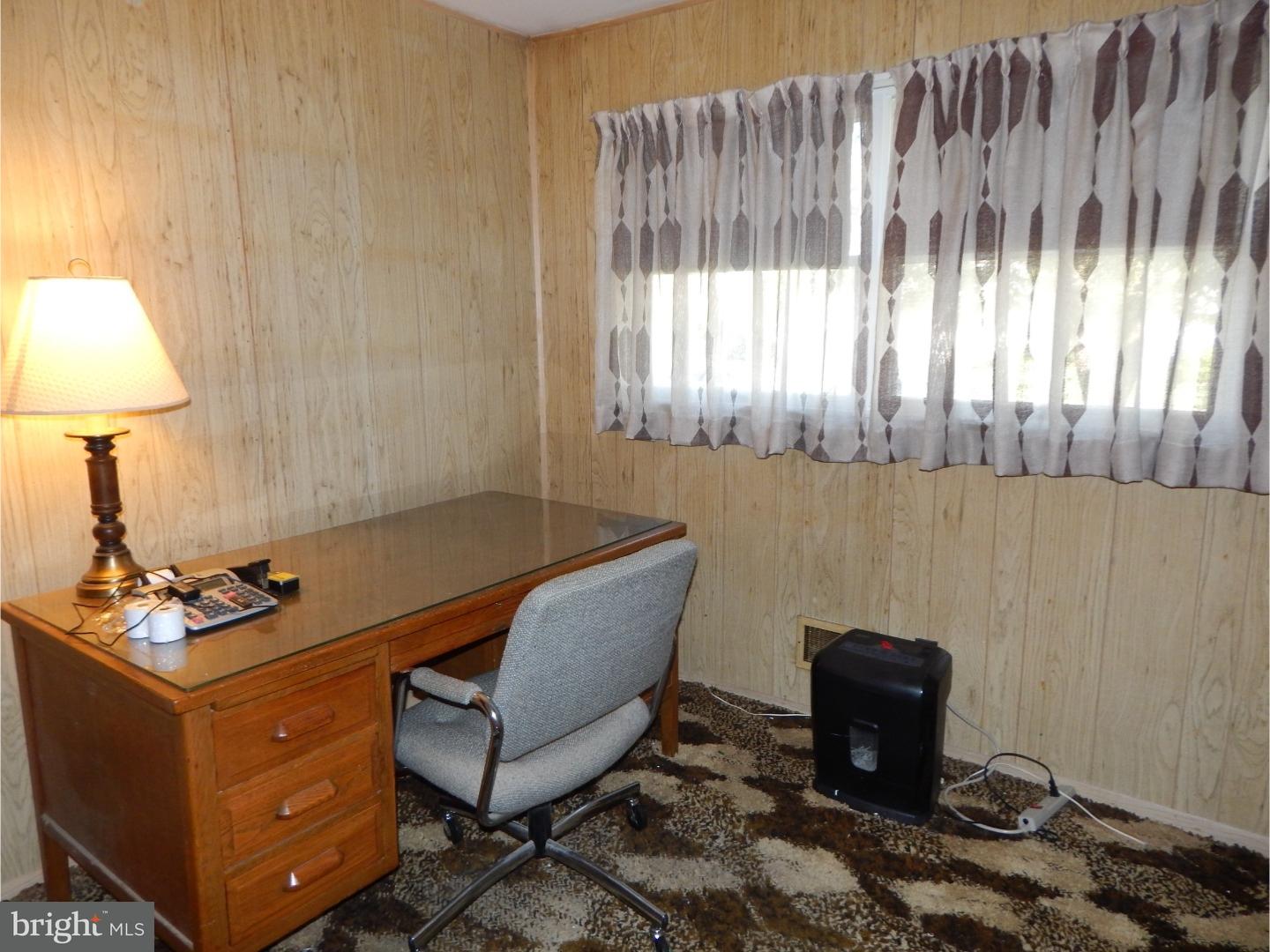 25 Downing Road Hamilton, NJ 08690 - Photo 8 of 14 a room with furniture and a window