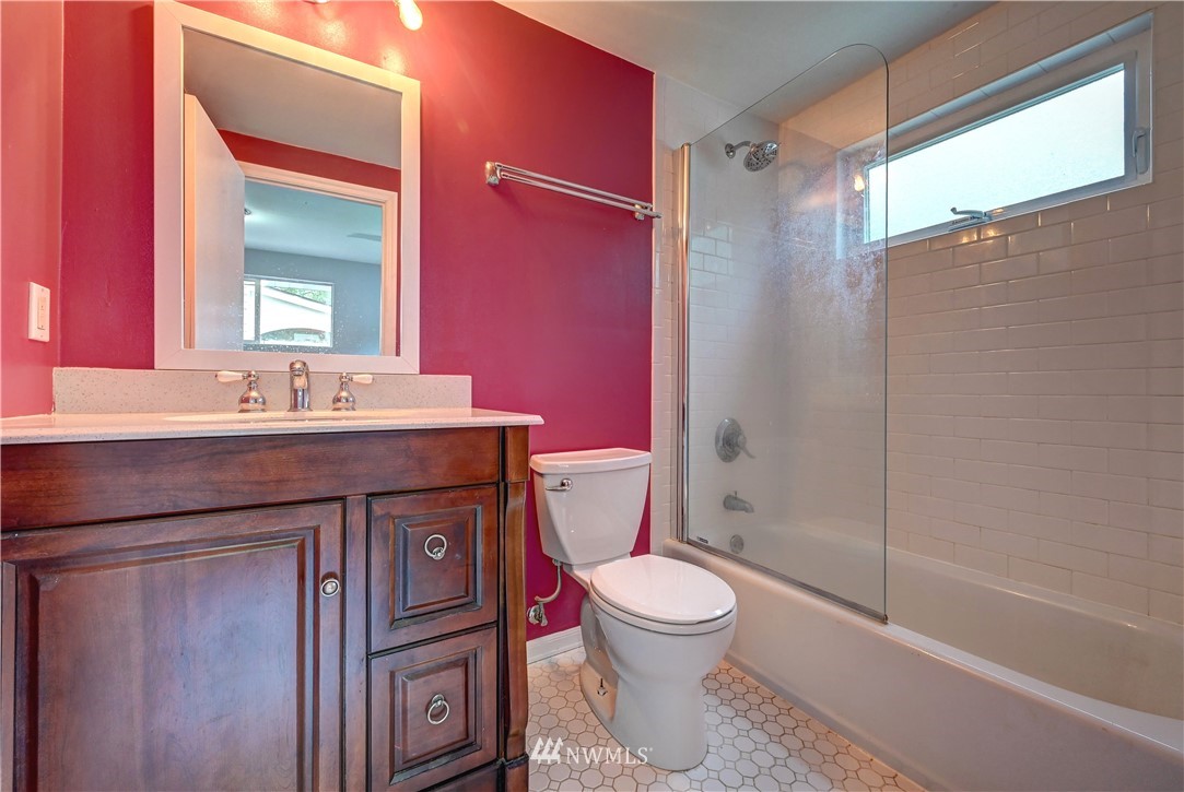 3232 Southeast 5th Street Renton, WA 98058 - Photo 12 of 20 a bathroom with a sink a toilet and shower