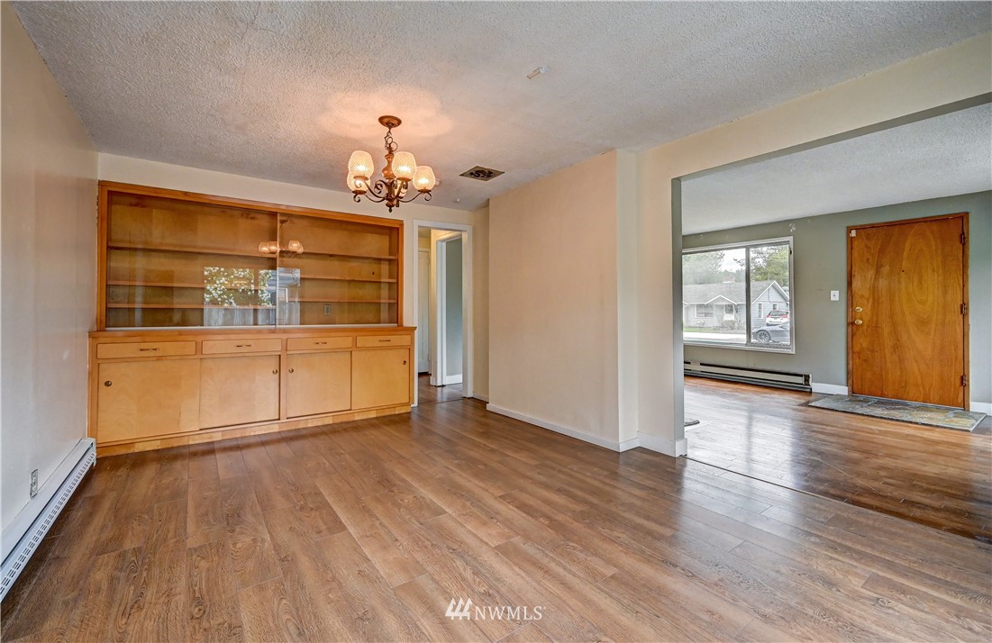 3232 Southeast 5th Street Renton, WA 98058 - Photo 4 of 20 wooden floor chandelier and windows in a room