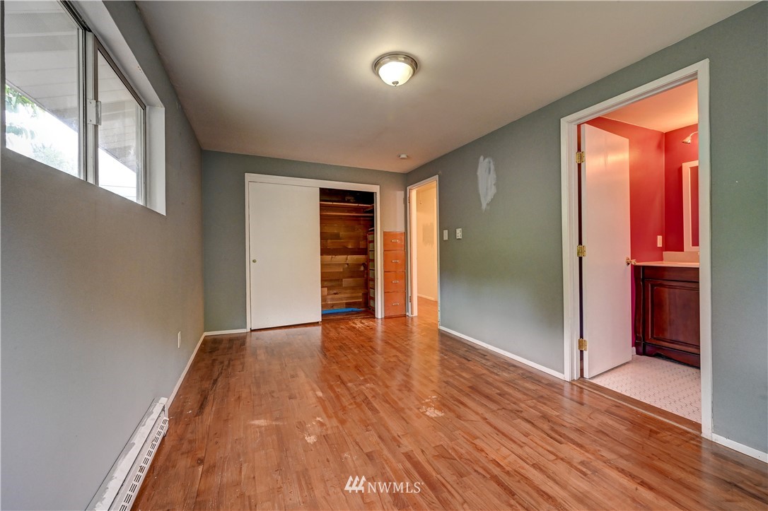 3232 Southeast 5th Street Renton, WA 98058 - Photo 10 of 20 wooden floor in an empty room with a window