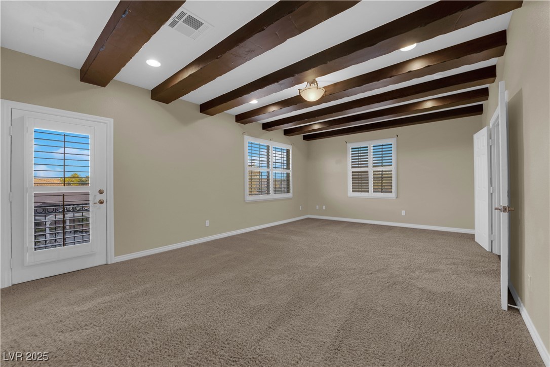 10057 Portula Valley Street Las Vegas, NV 89178 - Photo 45 of 56 Empty room featuring beam ceiling, light carpet, and recessed lighting