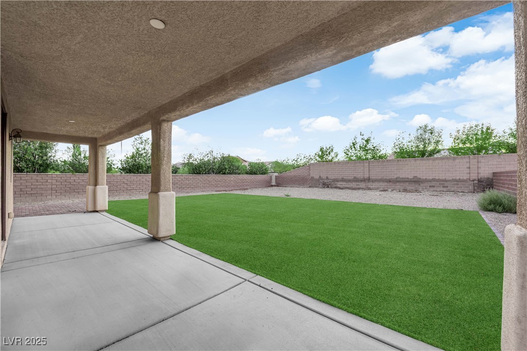 10057 Portula Valley Street Las Vegas, NV 89178 - Photo 48 of 56 Fenced backyard with a patio area