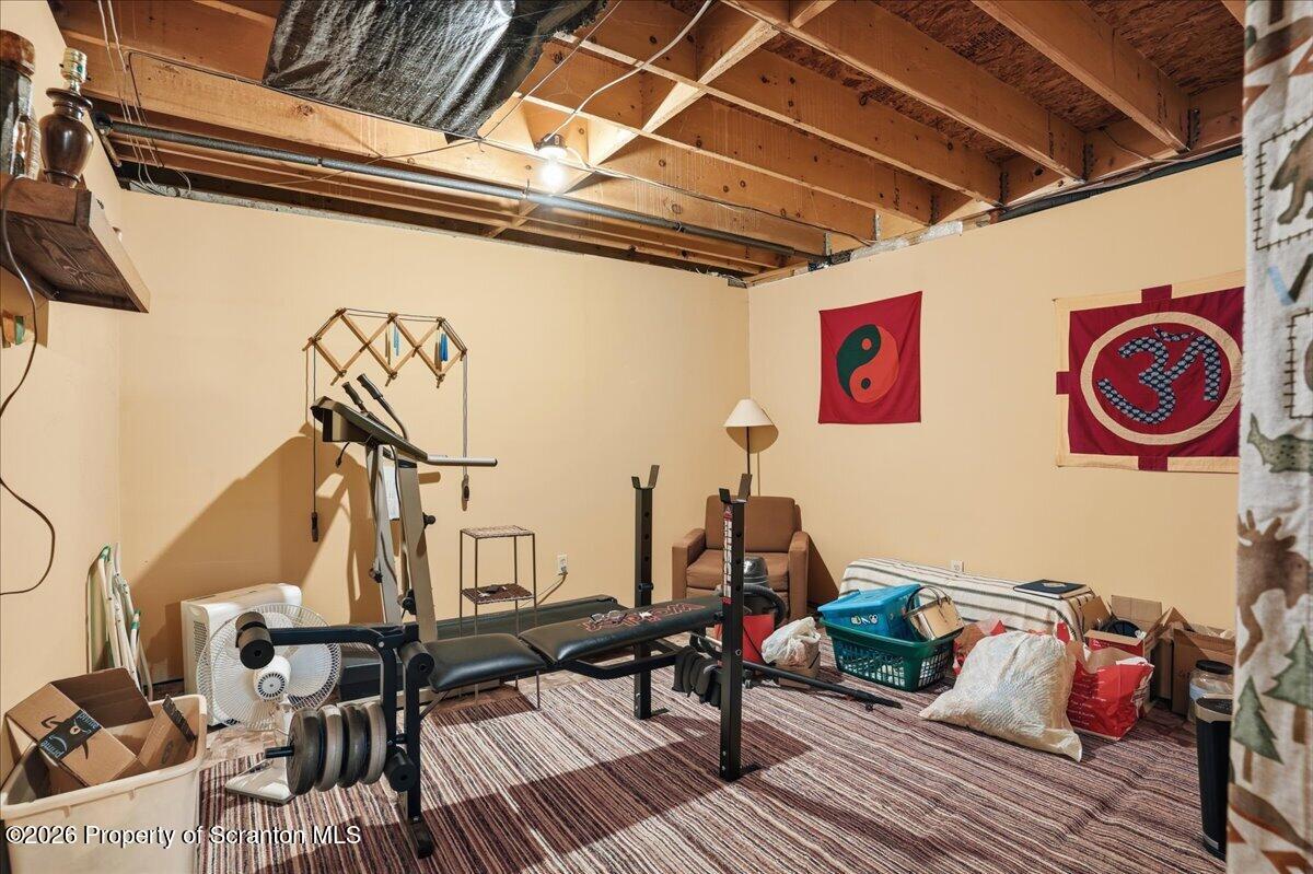 5231 Fiddle Lake Road Thompson, PA 18465 - Photo 20 of 34 a view of a room with gym equipment
