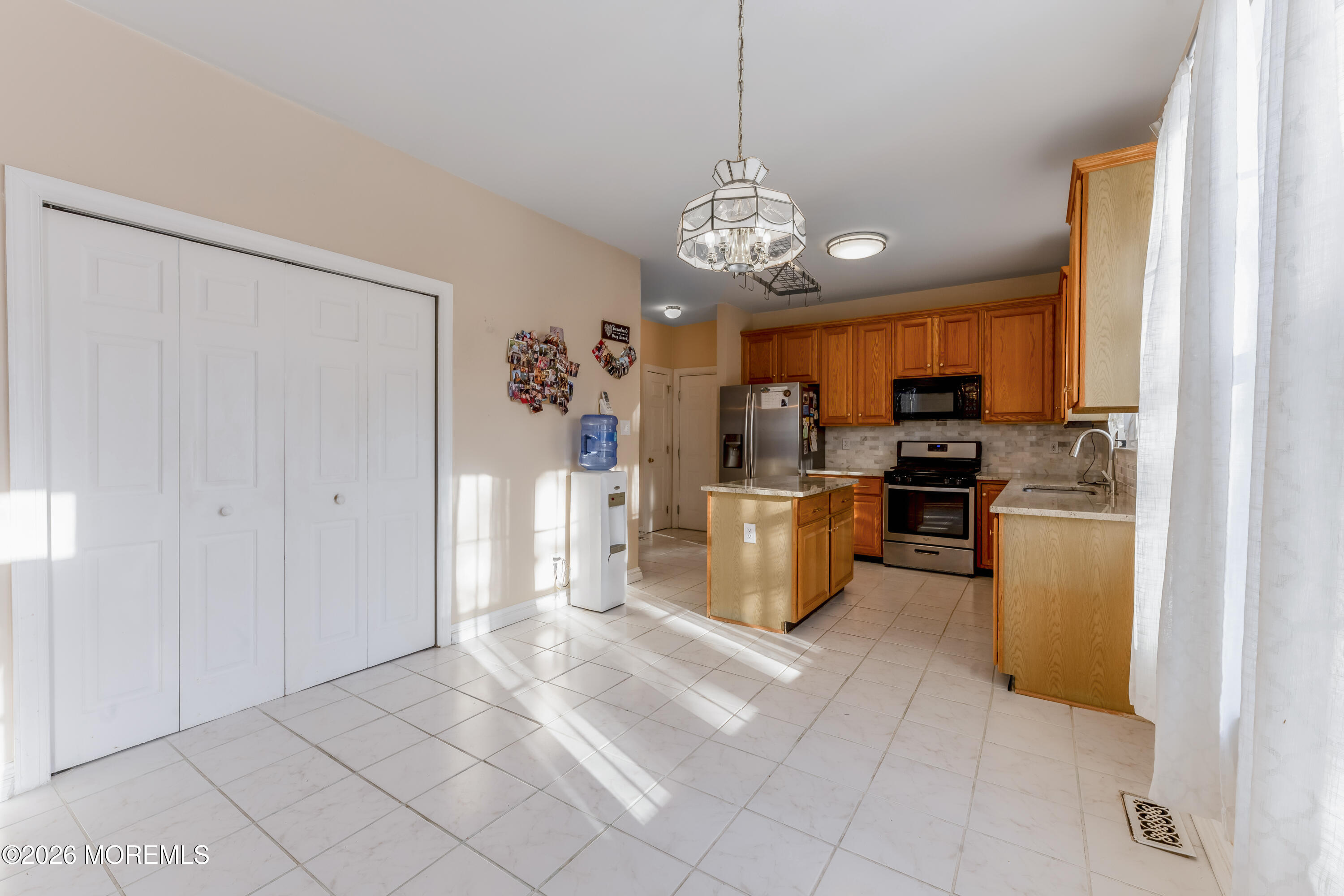 58 Danella Way Howell, NJ 07731 - Photo 11 of 46 a view of a kitchen with stainless steel appliances granite countertop a refrigerator and microwave