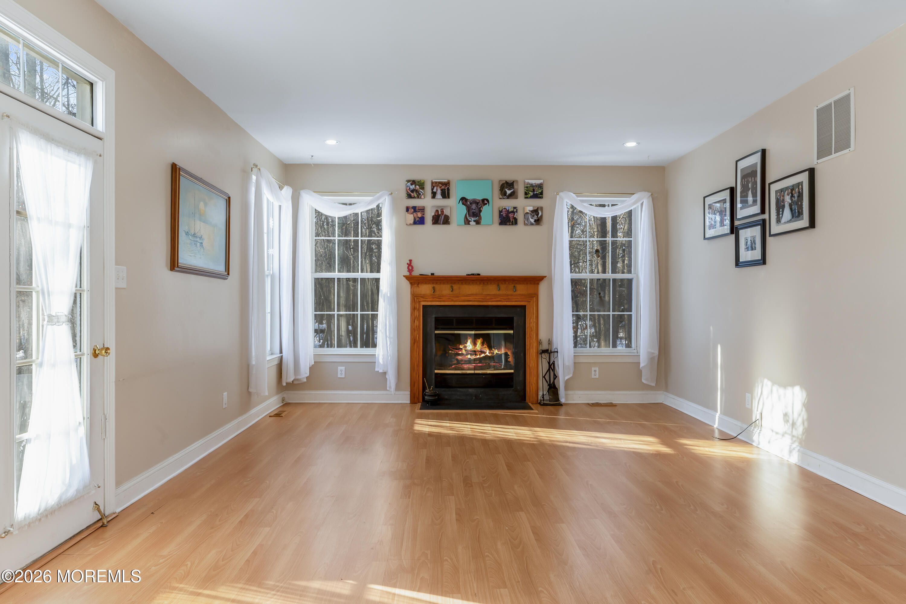 58 Danella Way Howell, NJ 07731 - Photo 15 of 46 a view of an empty room with window and fire place