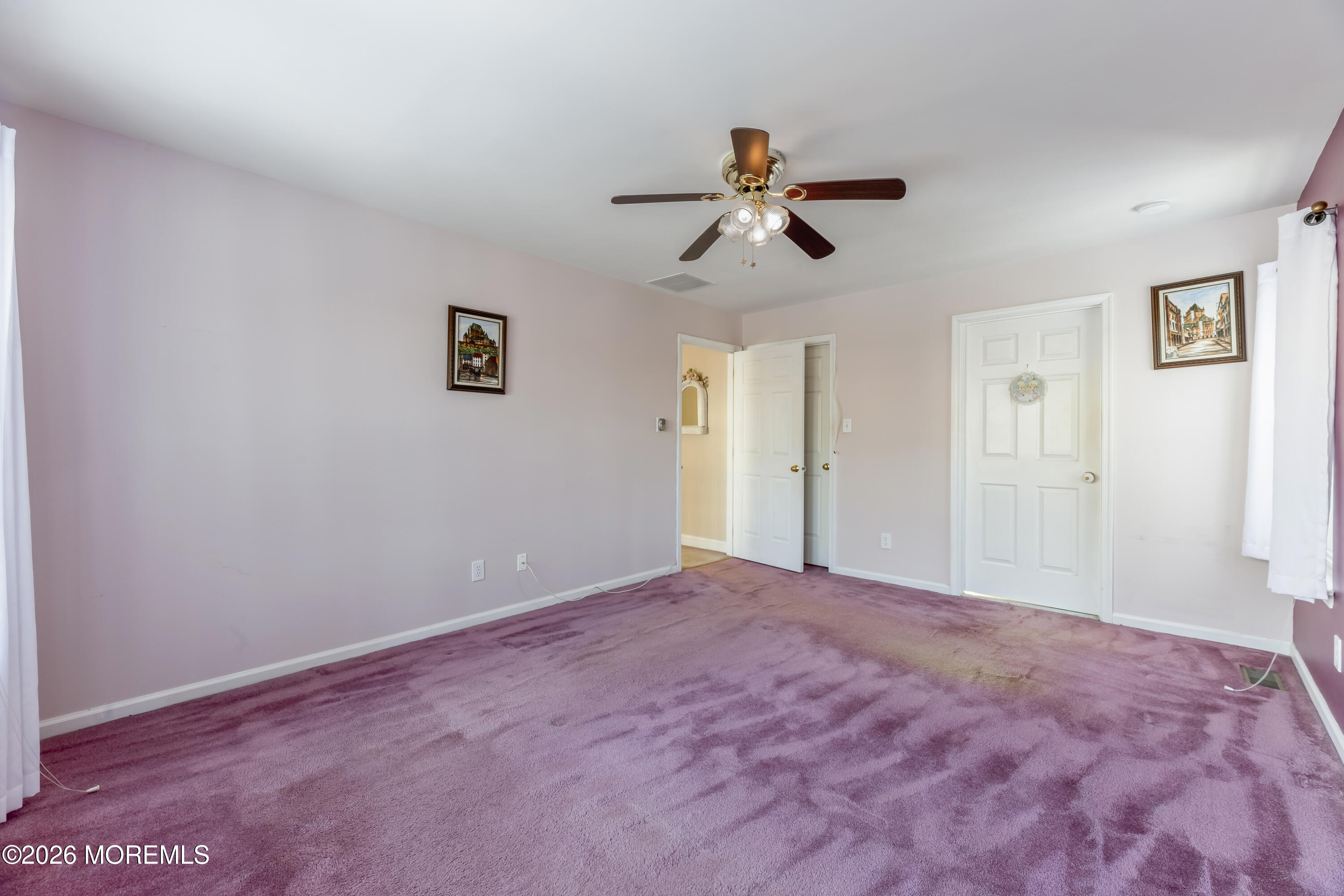 58 Danella Way Howell, NJ 07731 - Photo 21 of 46 a view of a big room with wooden floor and windows in a room