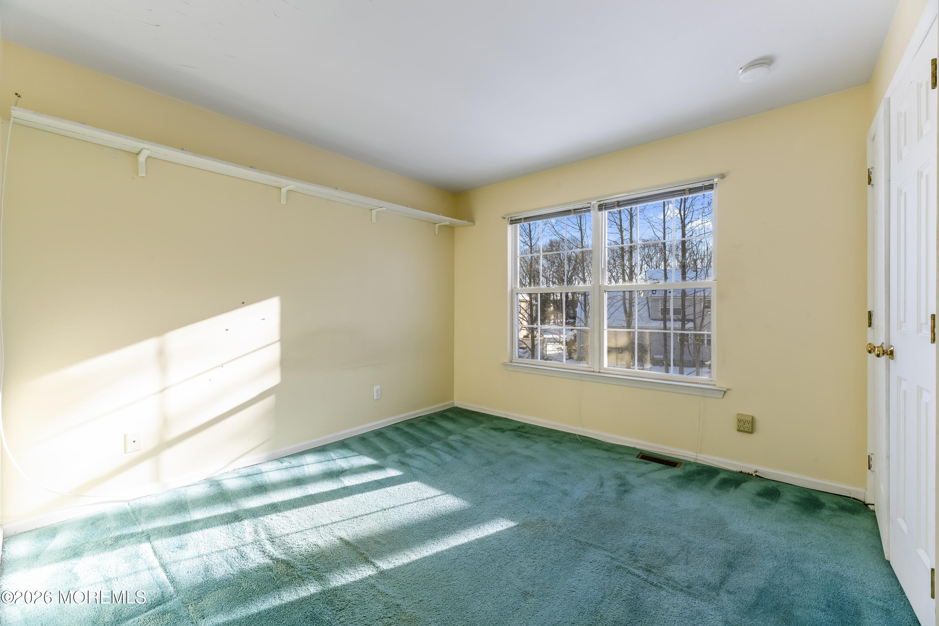 58 Danella Way Howell, NJ 07731 - Photo 25 of 46 a view of an empty room with a window
