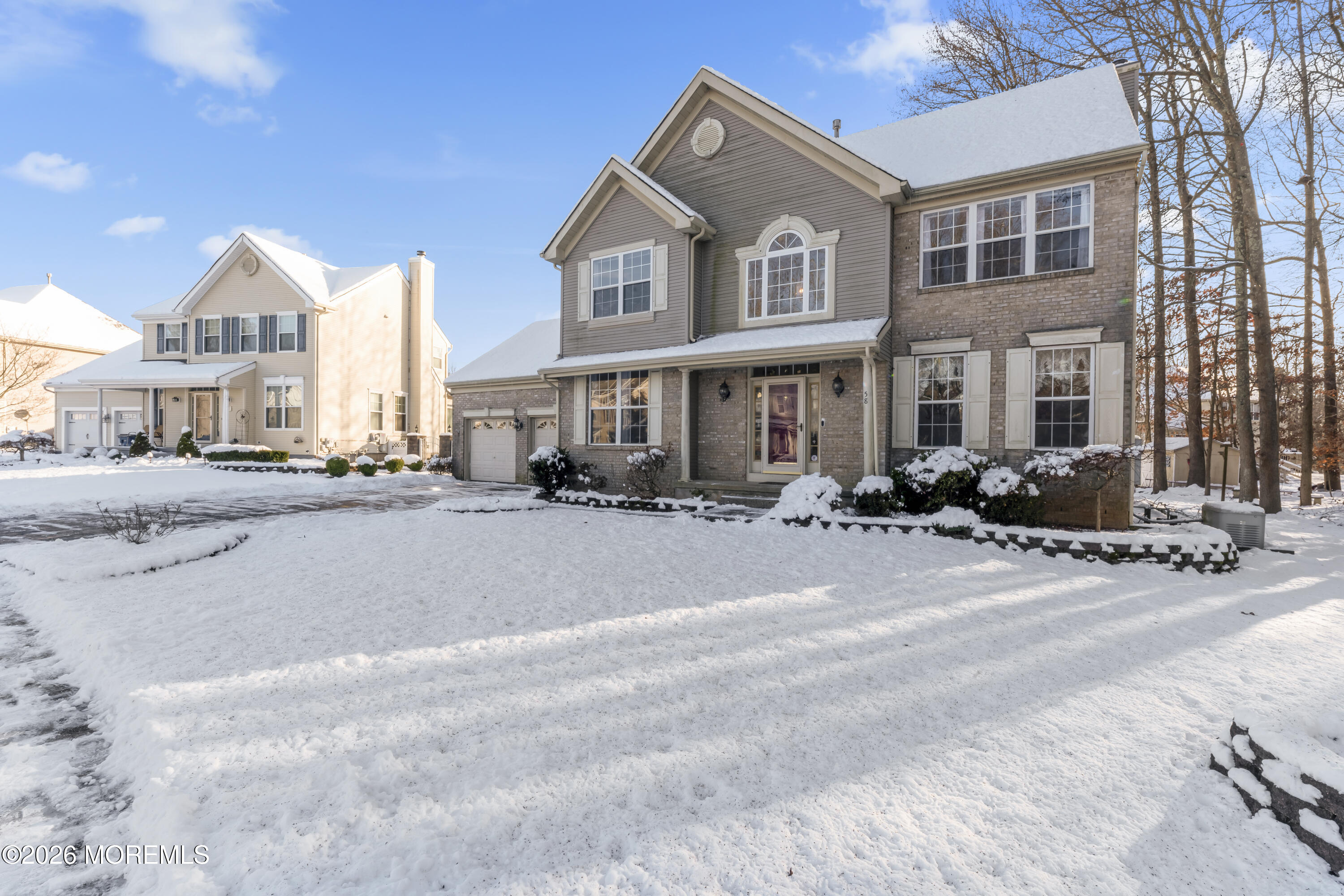 58 Danella Way Howell, NJ 07731 - Photo 3 of 46 a city street lined with buildings and cars
