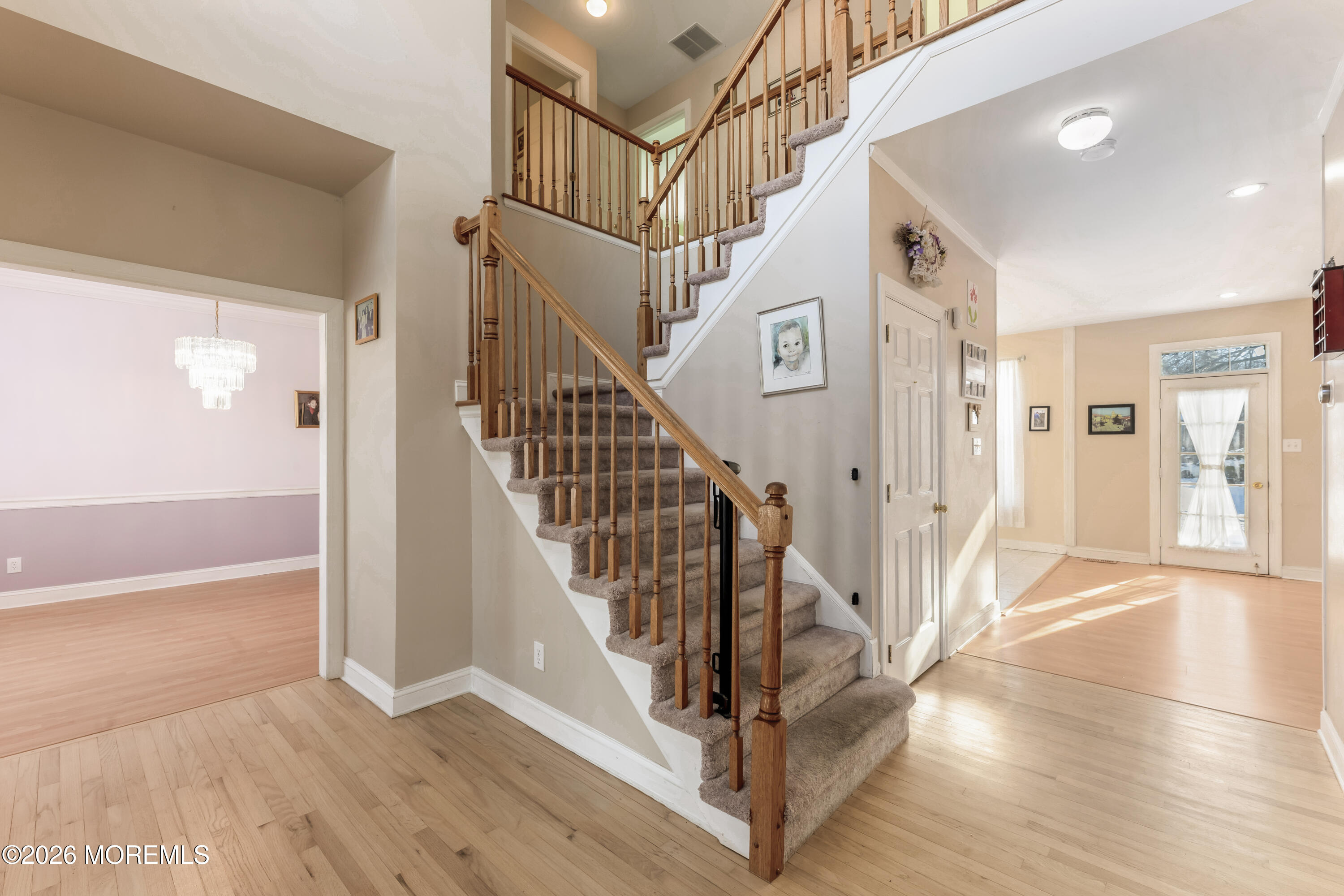 58 Danella Way Howell, NJ 07731 - Photo 4 of 46 a view of entryway with wooden floor and a front door