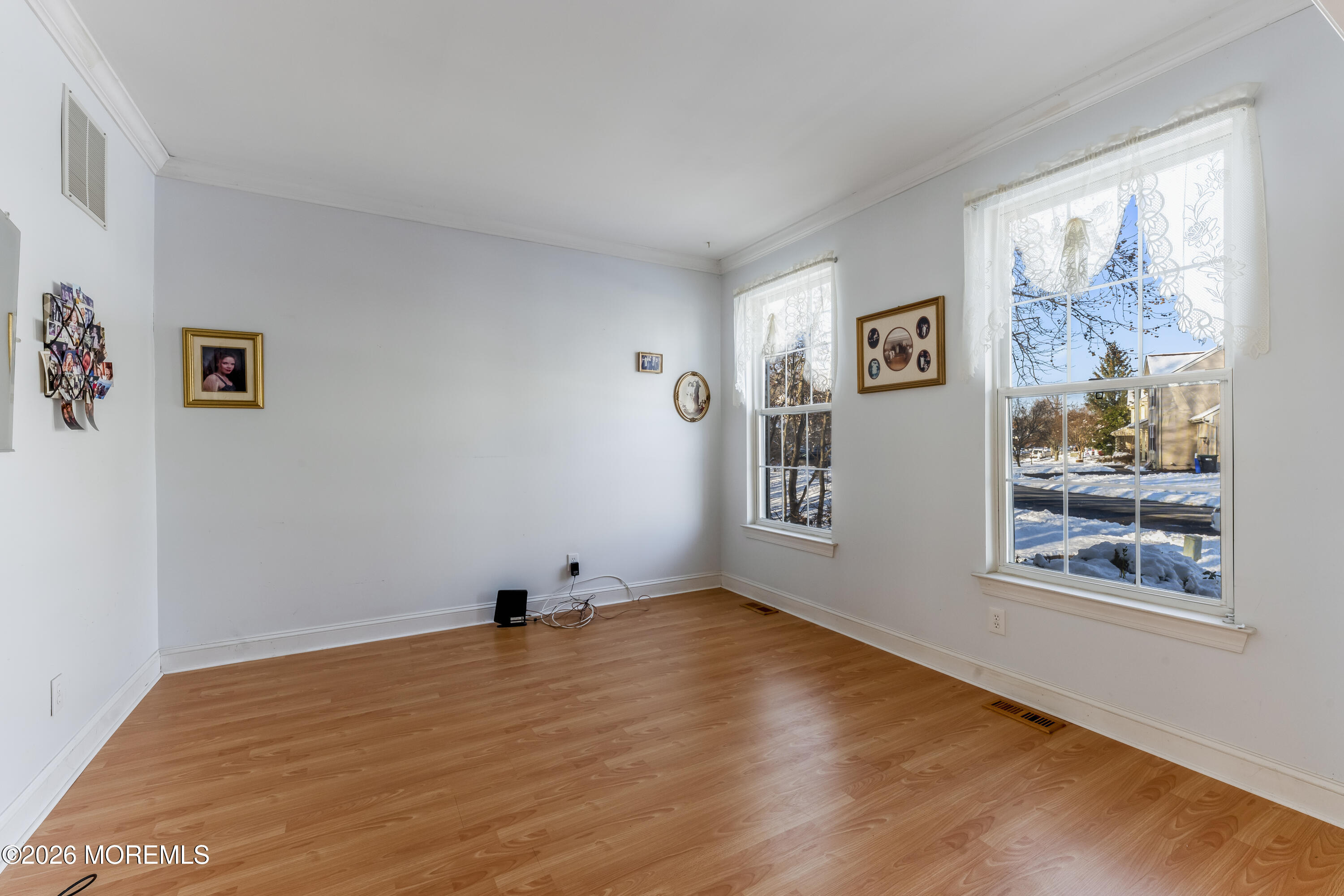 58 Danella Way Howell, NJ 07731 - Photo 6 of 46 a room with painting on the wall and a window