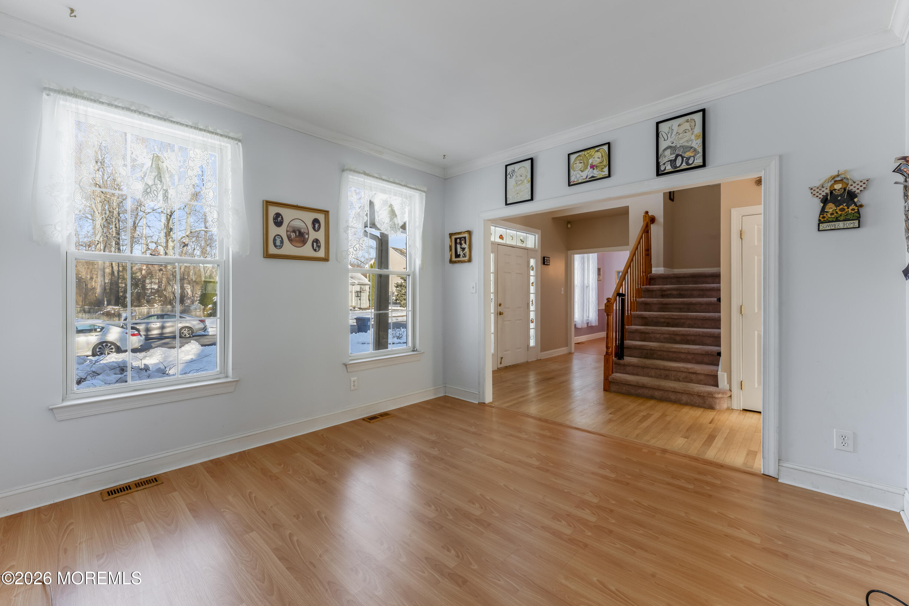 58 Danella Way Howell, NJ 07731 - Photo 7 of 46 a view of an empty room with wooden floor and a window