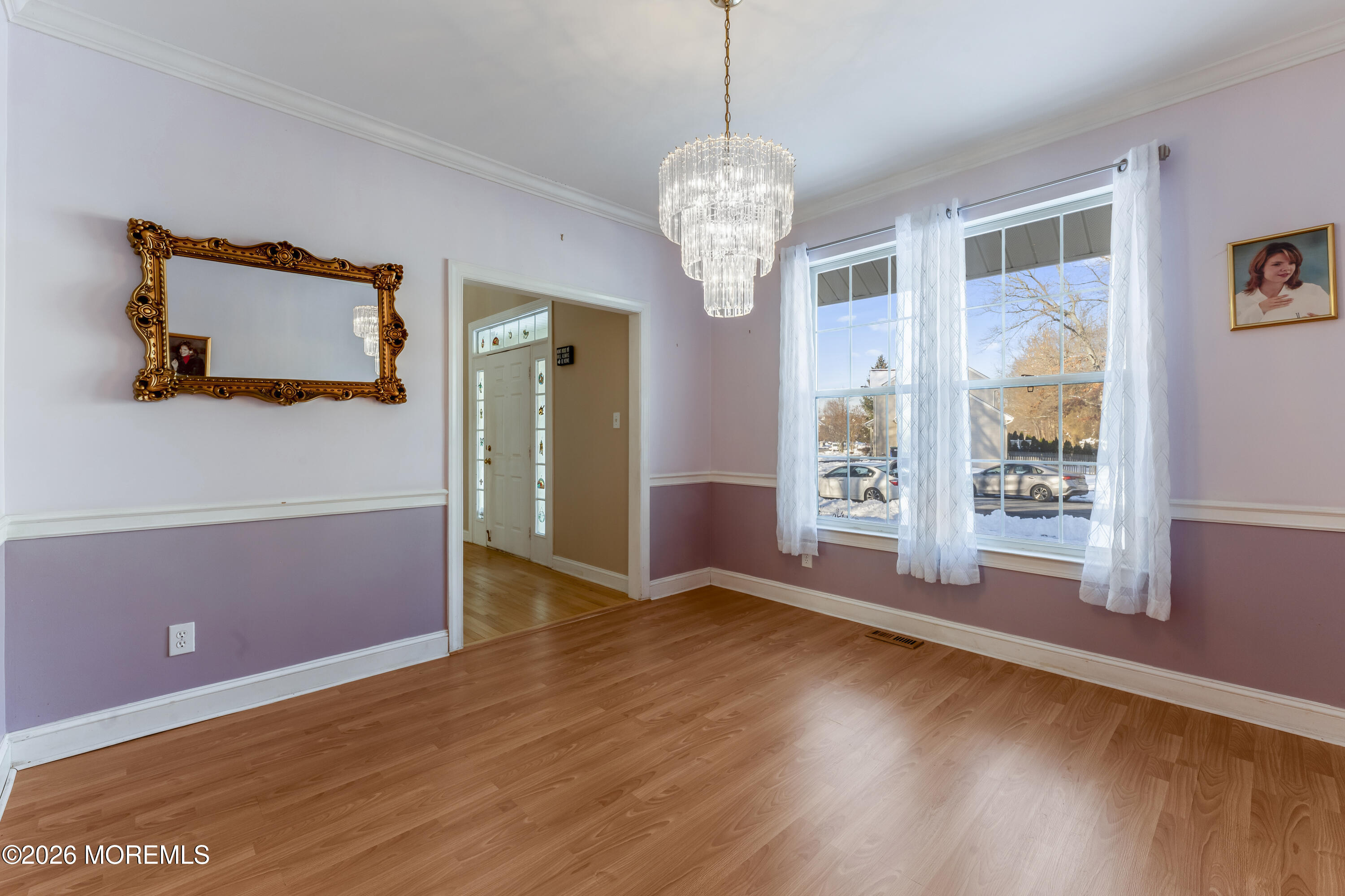 58 Danella Way Howell, NJ 07731 - Photo 9 of 46 a view of a livingroom with wooden floor and a large window