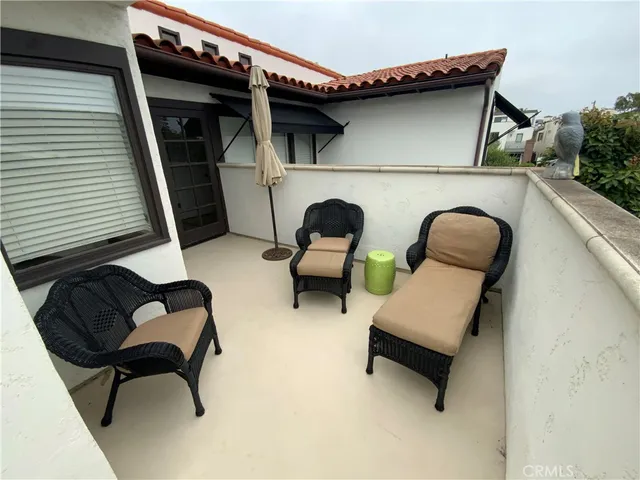 a living room with furniture and a chair