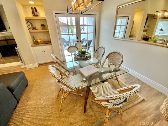 a view of a dining room with furniture and a window