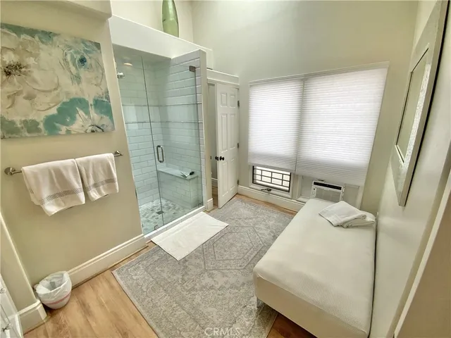 a spacious bathroom with a granite countertop tub sink and mirror
