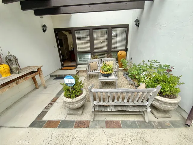 a view of a living room and a potted plant