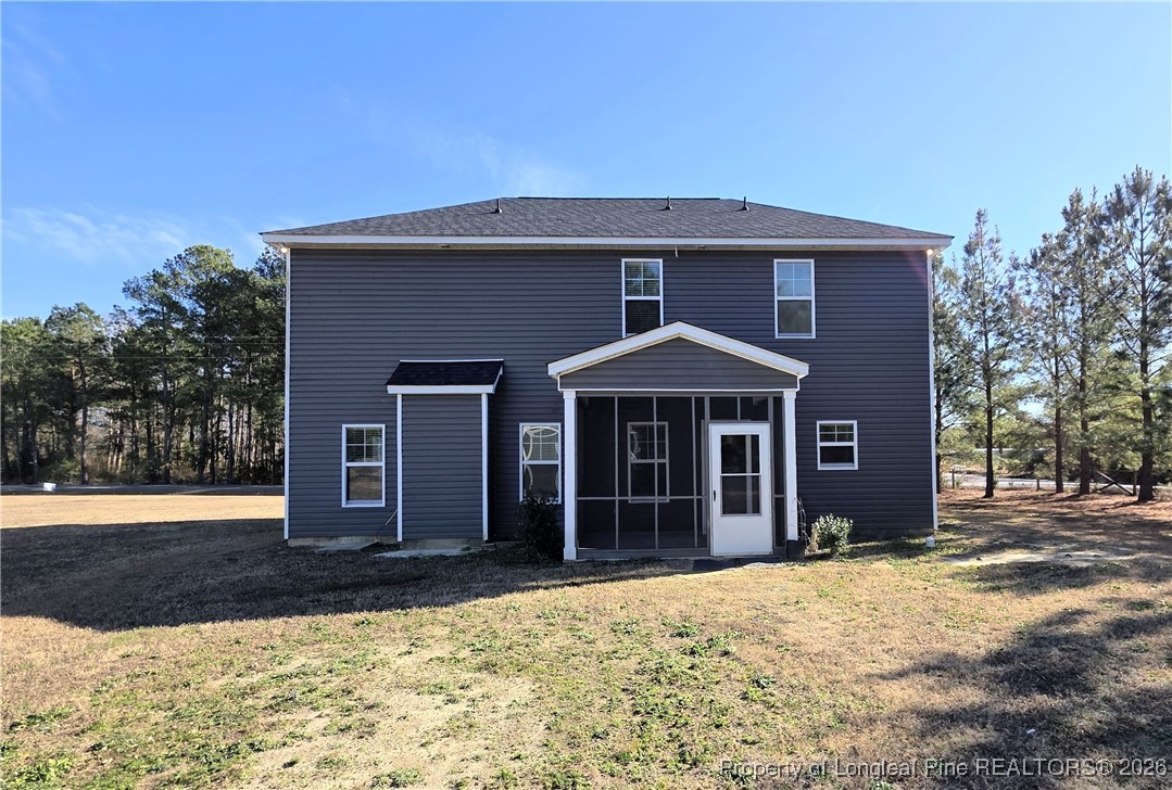 7850 Rufus Johnson Road Fayetteville, NC 28306 - Photo 25 of 25 a front view of a house with a yard